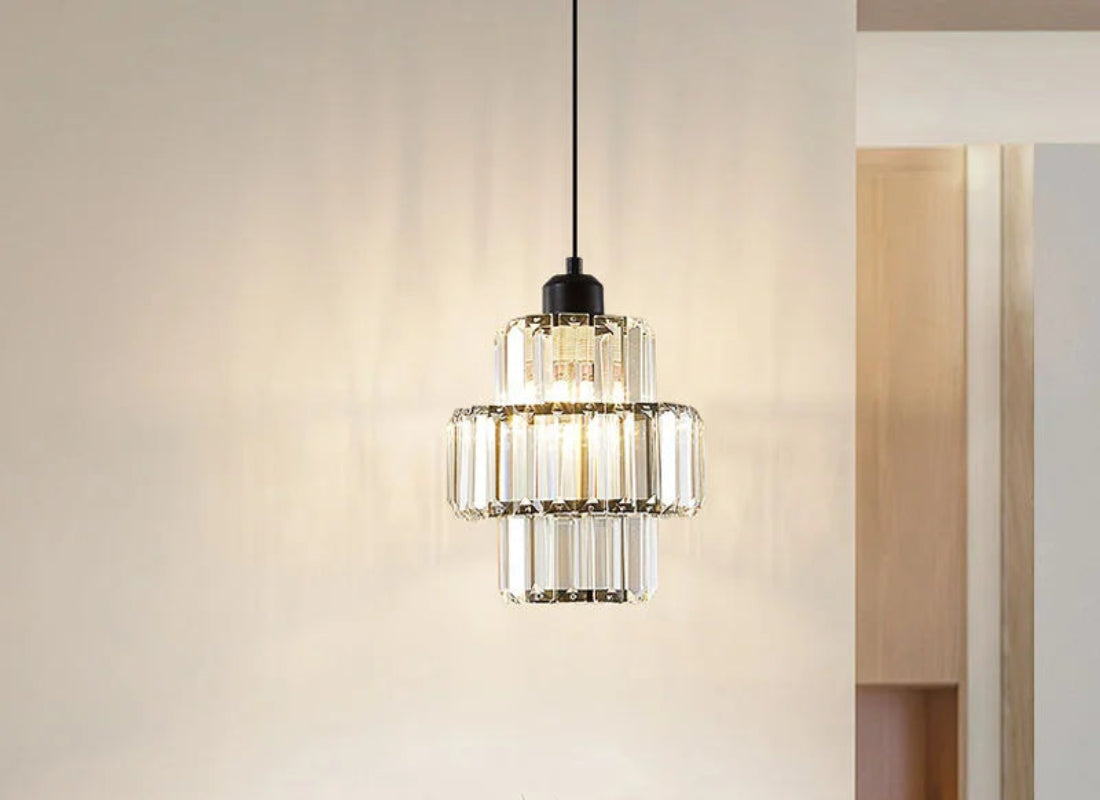 Modern pendant light hanging in a room with neutral decor