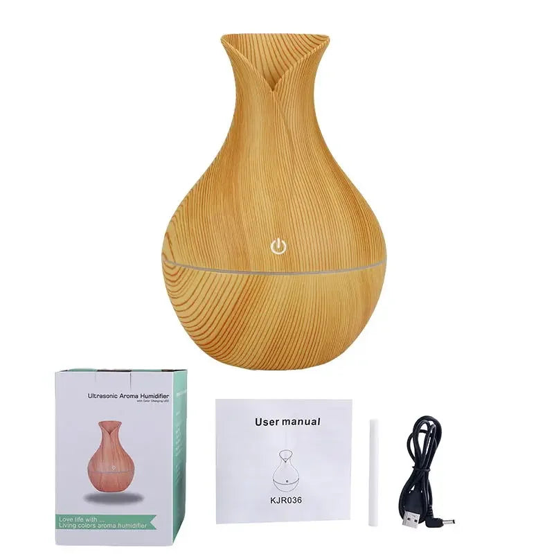 Wooden-textured diffuser with packaging, user manual, and USB cable on a white background