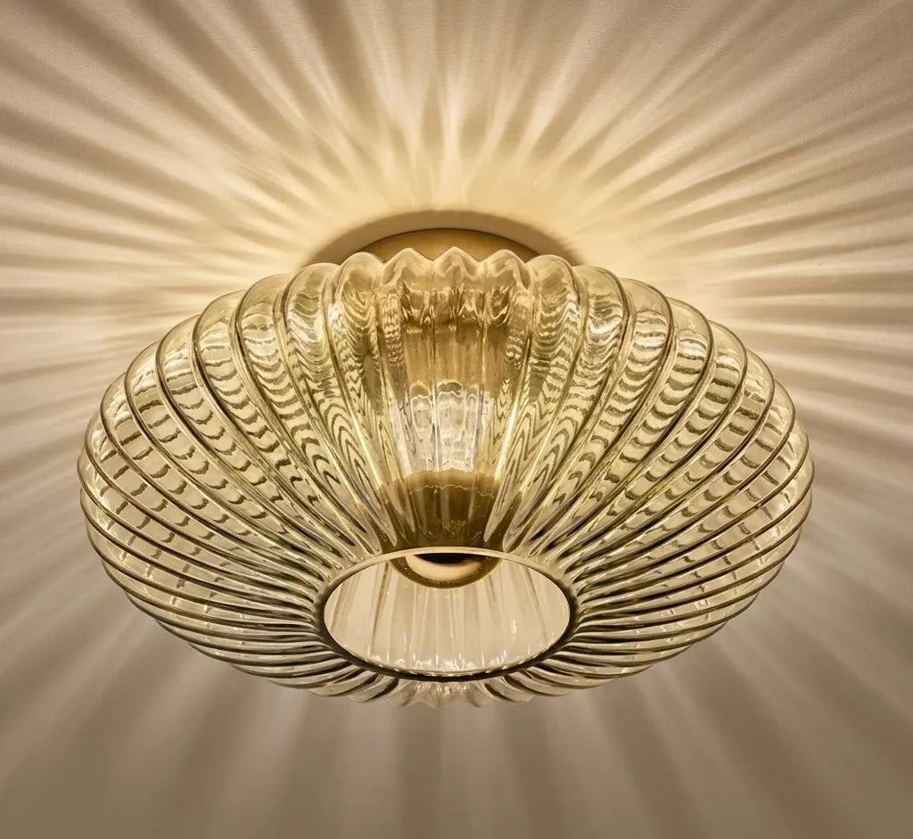 Decorative ceiling light fixture with a textured glass shade on a neutral background