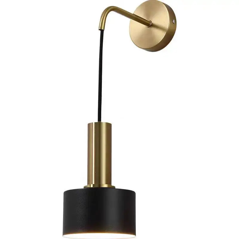 Wall-mounted lamp with gold arm and black base on a white background