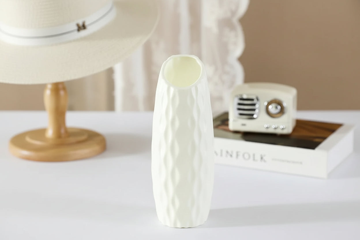 White ceramic vase with measurements on a blurred background
