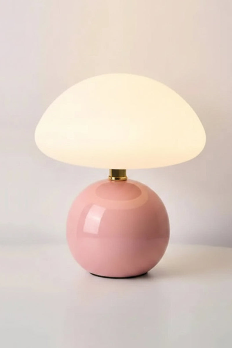 Pink ceramic table lamp with measurements on a light gray background