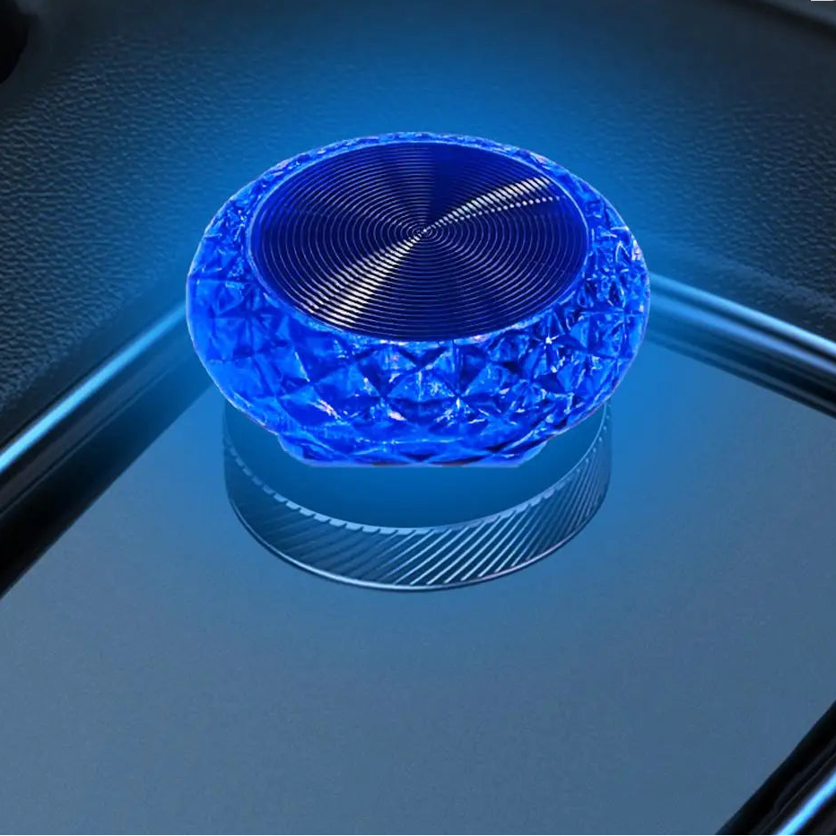 Blue illuminated object on a reflective surface
