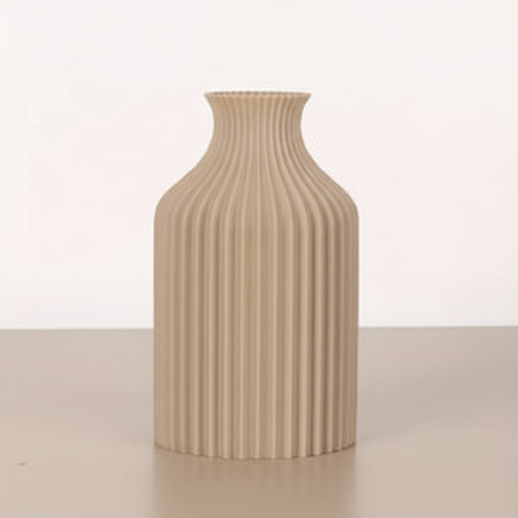 A ribbed ceramic vase in a light beige color