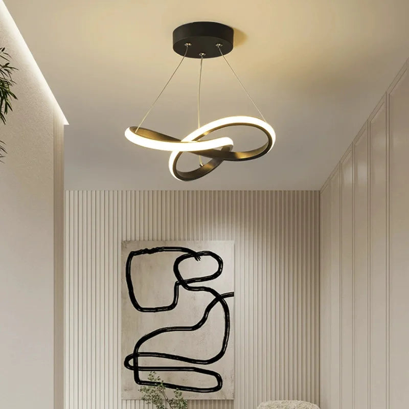 Modern ceiling light fixture in a room with abstract wall art