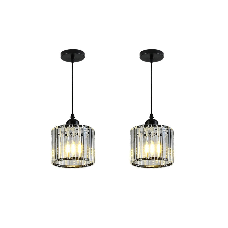 Two matching black pendant lights with clear crystal-like vertical rods,
