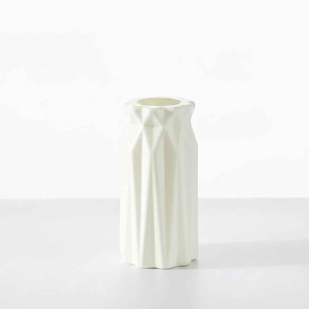 White decorative vase with measurements on a table