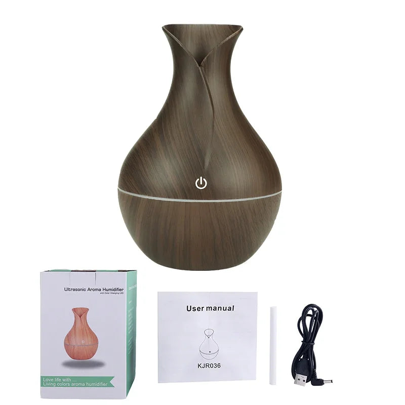 Wooden-textured diffuser with packaging, user manual, and USB cable on a white background