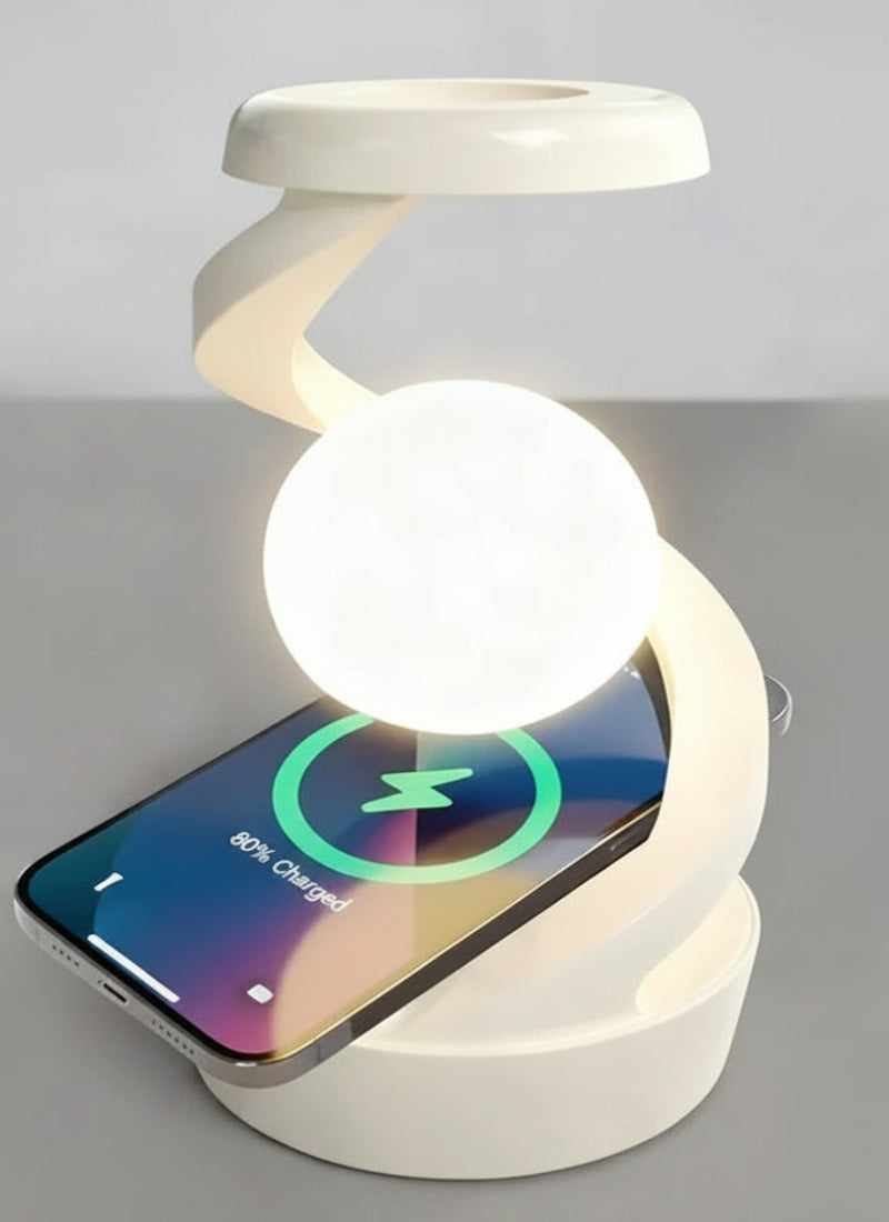 A white spiral-shaped wireless charging stand with a glowing spherical lamp, shown charging a smartphone.