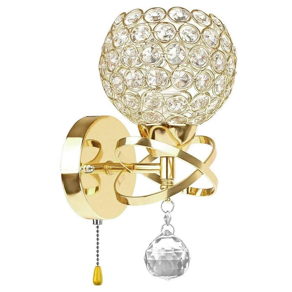 Decorative wall sconce with crystal ball and gold finish on a white background
