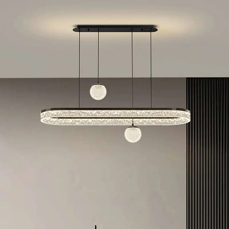 Modern pendant light fixture hanging from the ceiling in a minimalistic interior setting.
