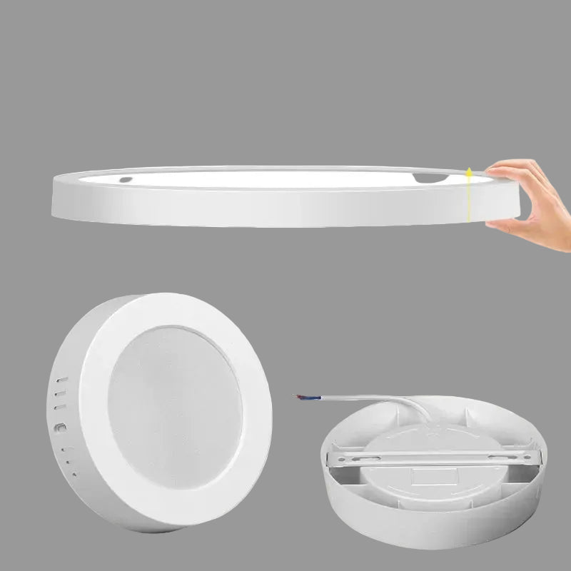 White LED ceiling light fixture with components on a gray background
