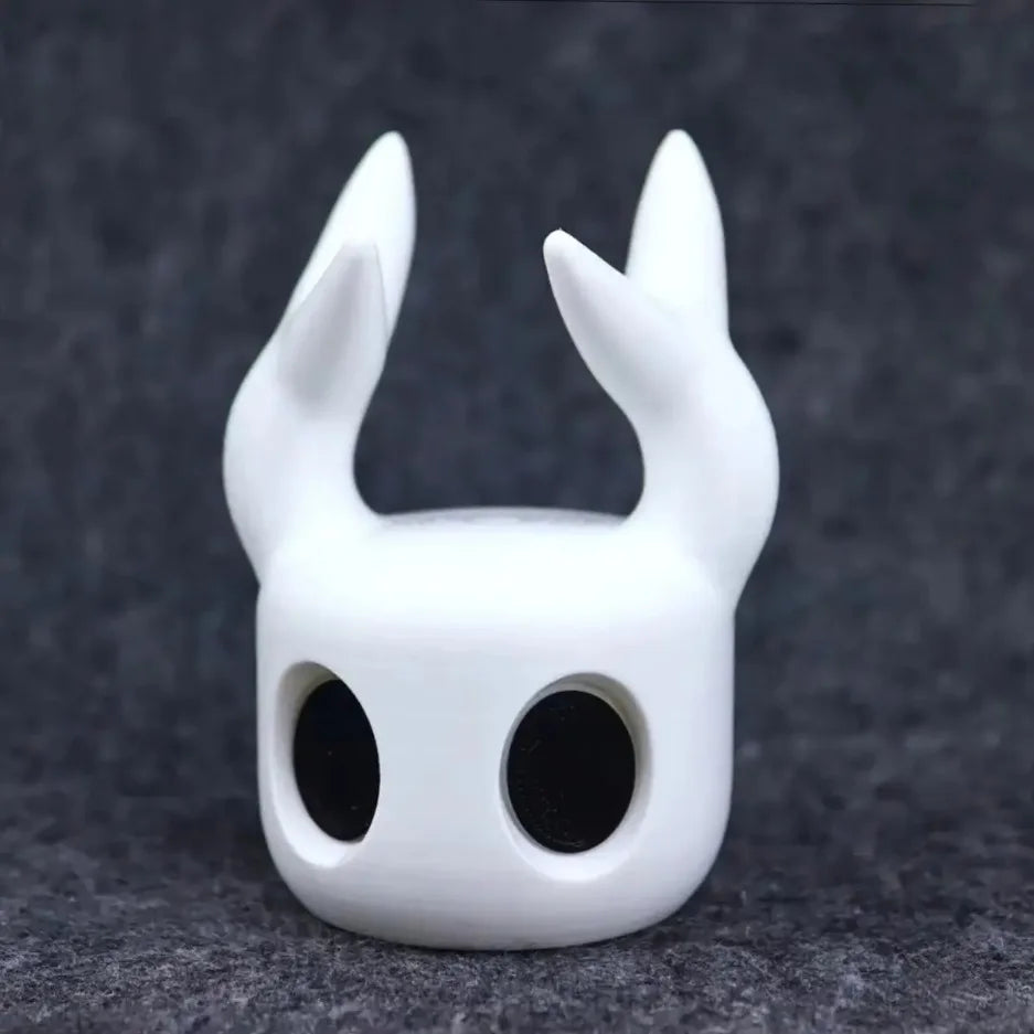 White helmet with large horns on a dark gray background