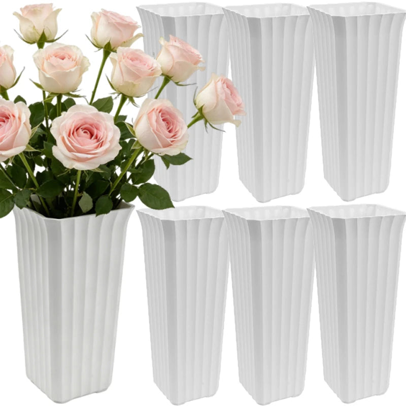 Six white ribbed rectangular flower pots arranged on a white background, with one pot shown holding a bouquet of pale pink roses.