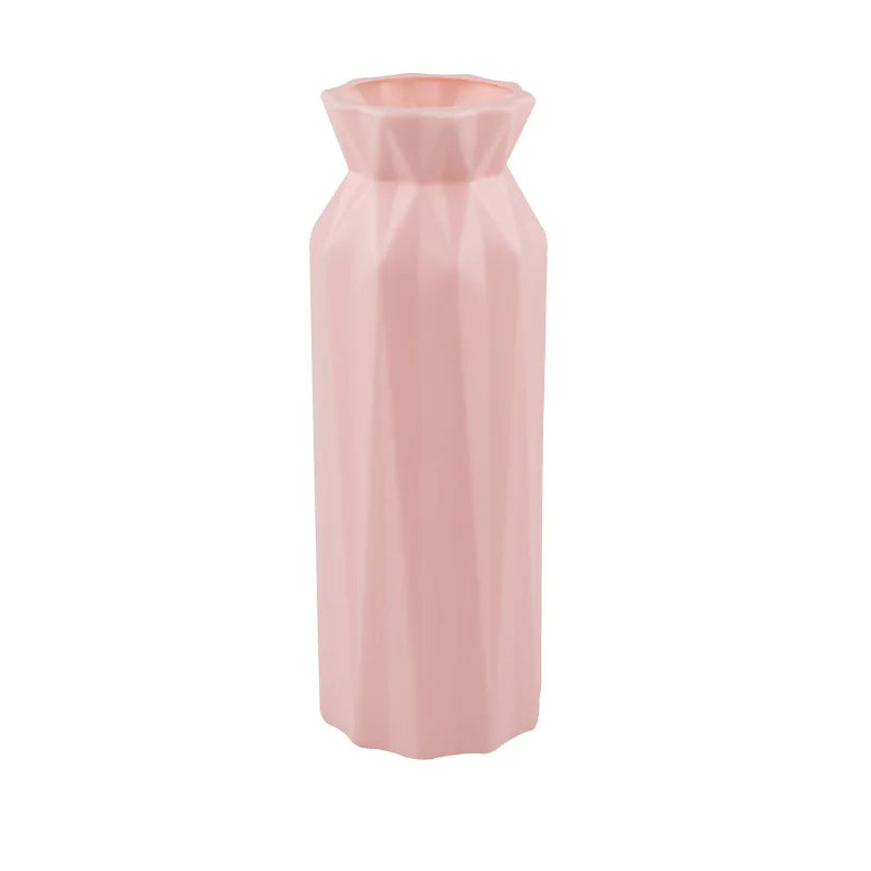 Pink hexagonal vase on a white background