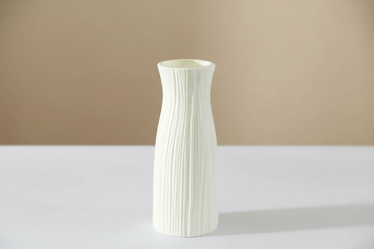 White textured vase with dimensions on a decorative setting