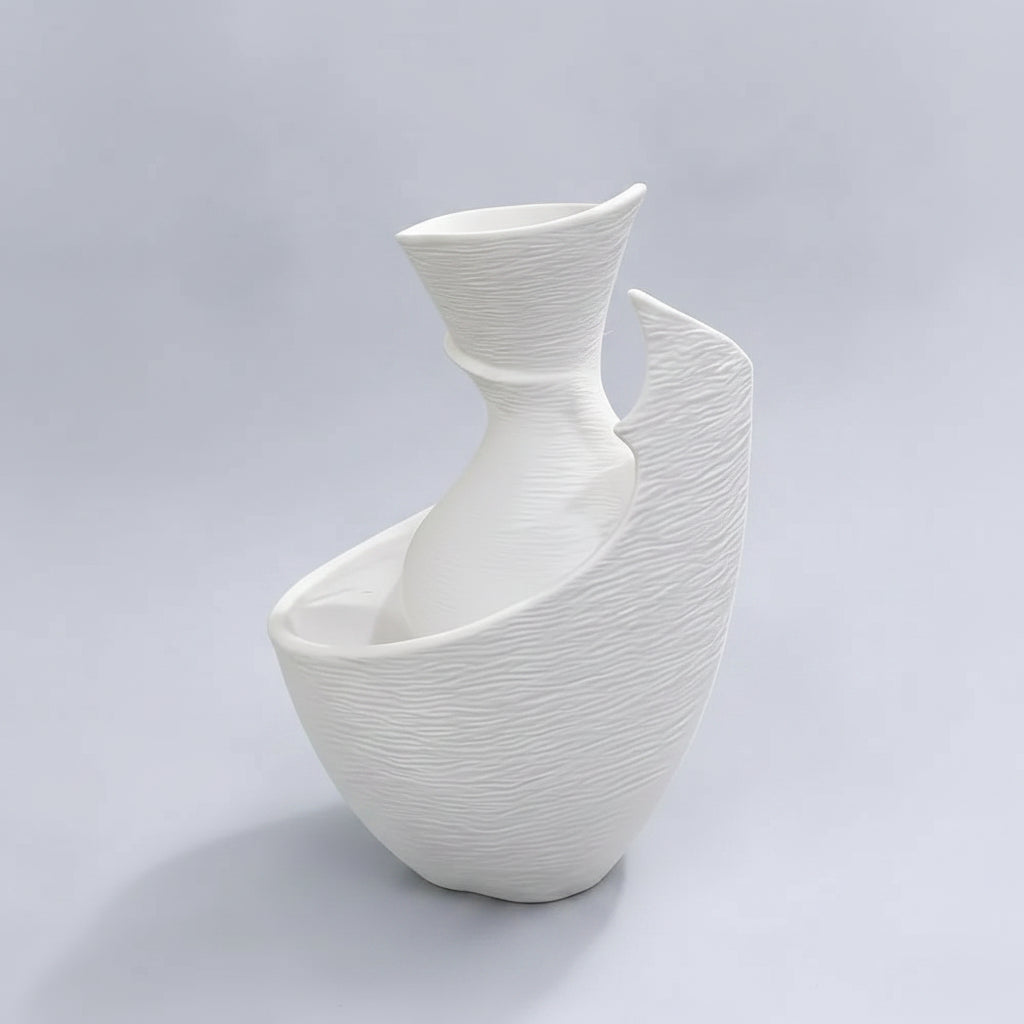 A white ceramic vase with a textured, ribbed surface and an organic, asymmetrical shape, shown with black dimension lines and text indicating a height of 10cm (3.94in) and a base width of 7.