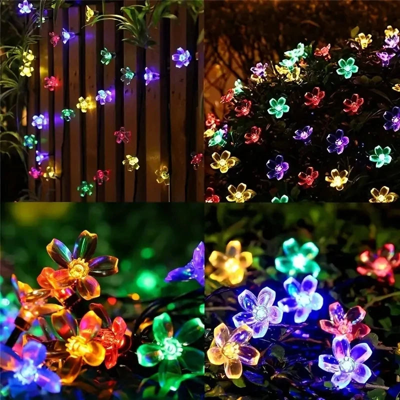 String lights with flower-shaped bulbs in various colors on a dark background.