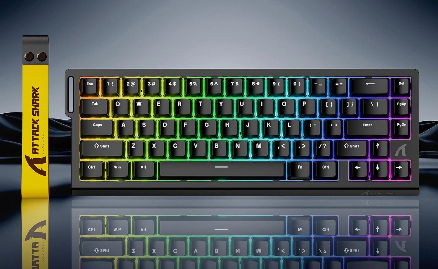 Mechanical keyboard with RGB lighting on a reflective surface, featuring Attack Shark branding.