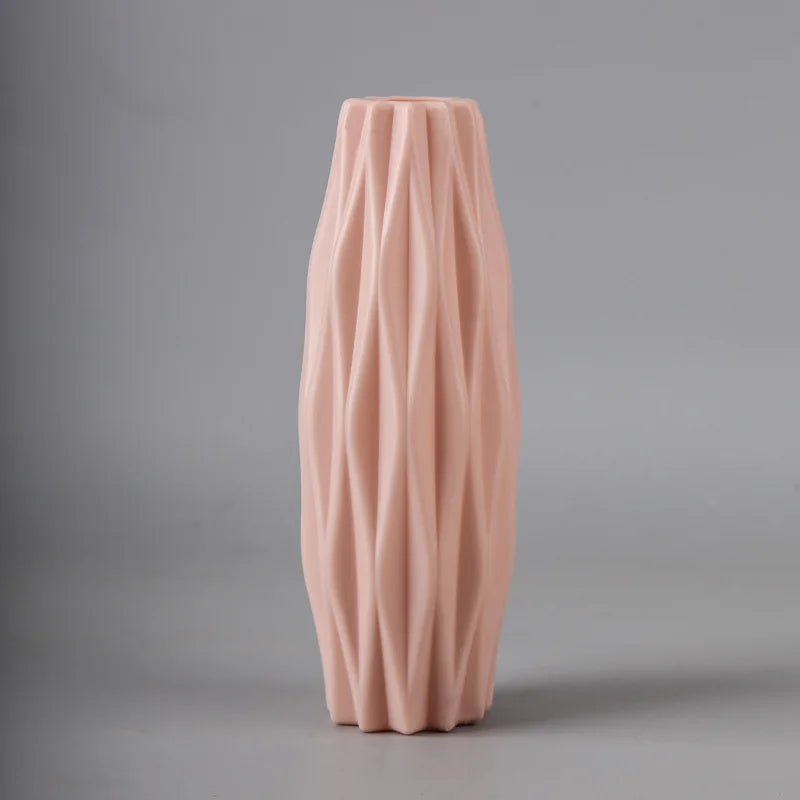 Pink textured vase on a gray background