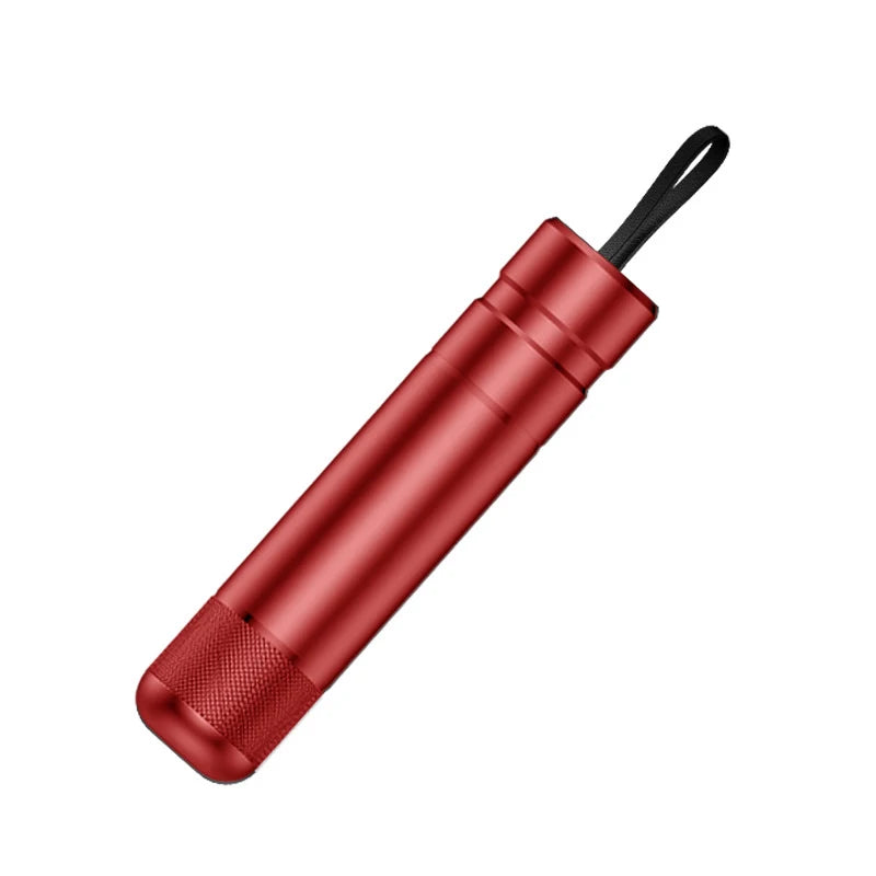 Red flashlight with black handle on a white background