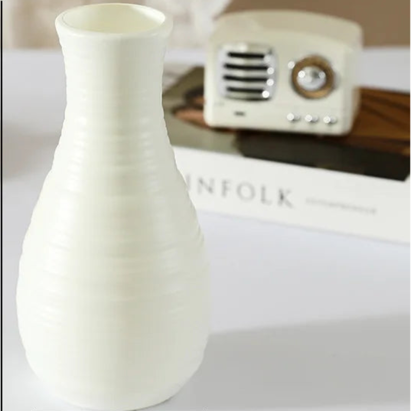 White vase with dimensions on a decorative background
