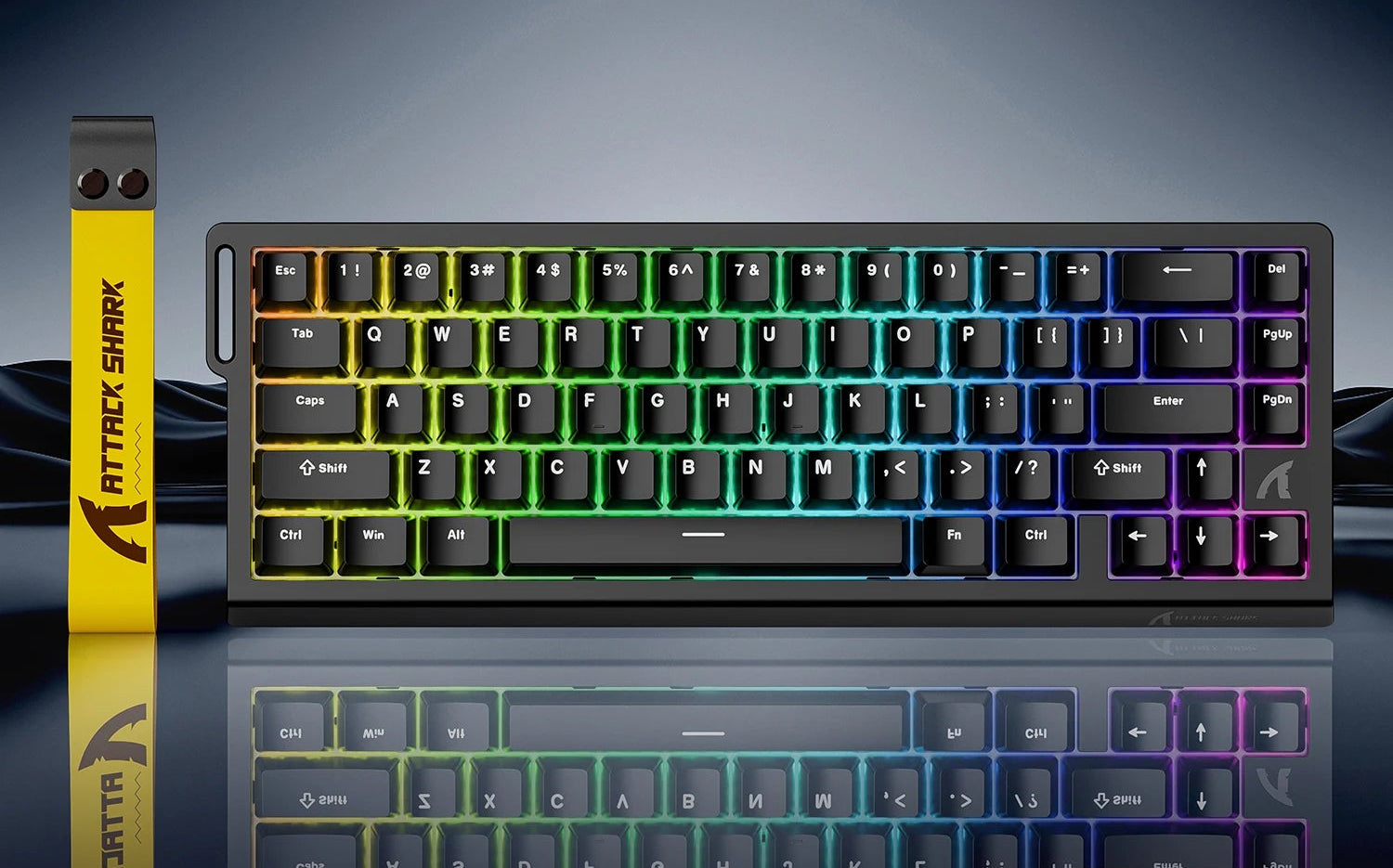 Mechanical keyboard with RGB lighting on a reflective surface, featuring Attack Shark branding.