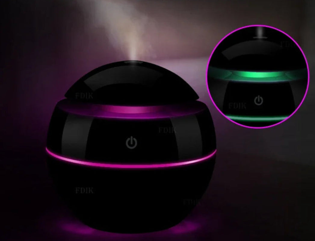 Black and purple light projector with power symbol on a dark background