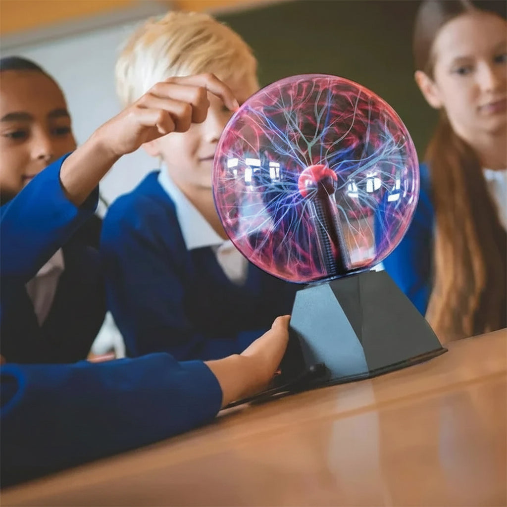 Children in a science class interacting with a plasma ball.