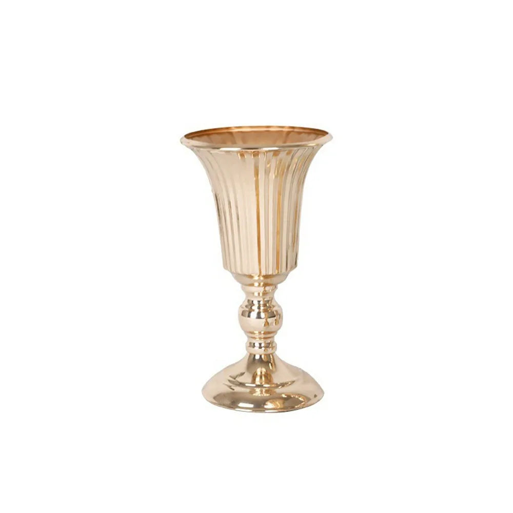 Gold metallic vase on a white background