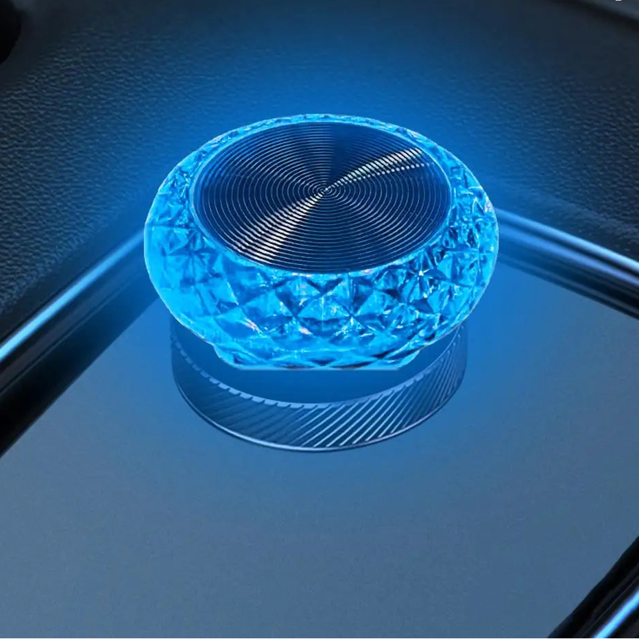 Blue crystal-like object on a reflective surface