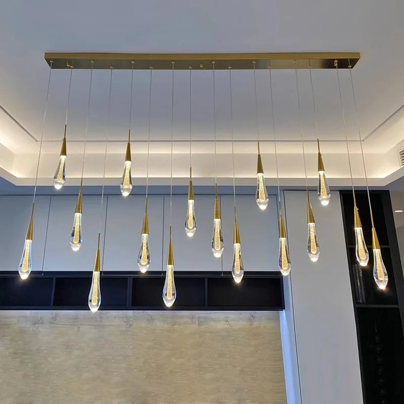 Modern pendant light fixture with multiple hanging lights in a room setting.