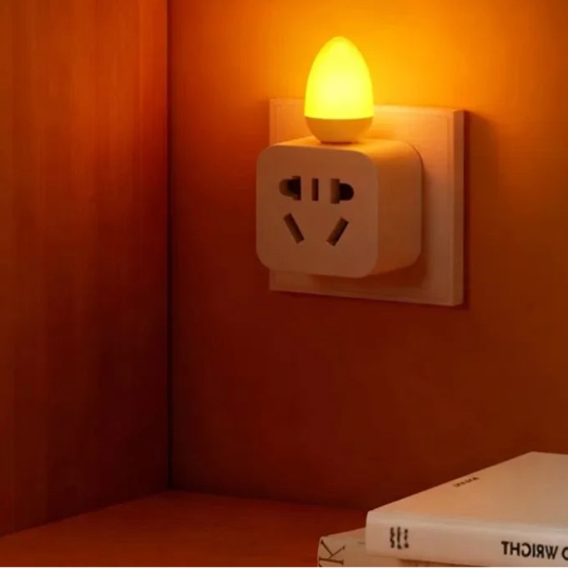 Energy-efficient LED night light on a wall with text highlighting features.
