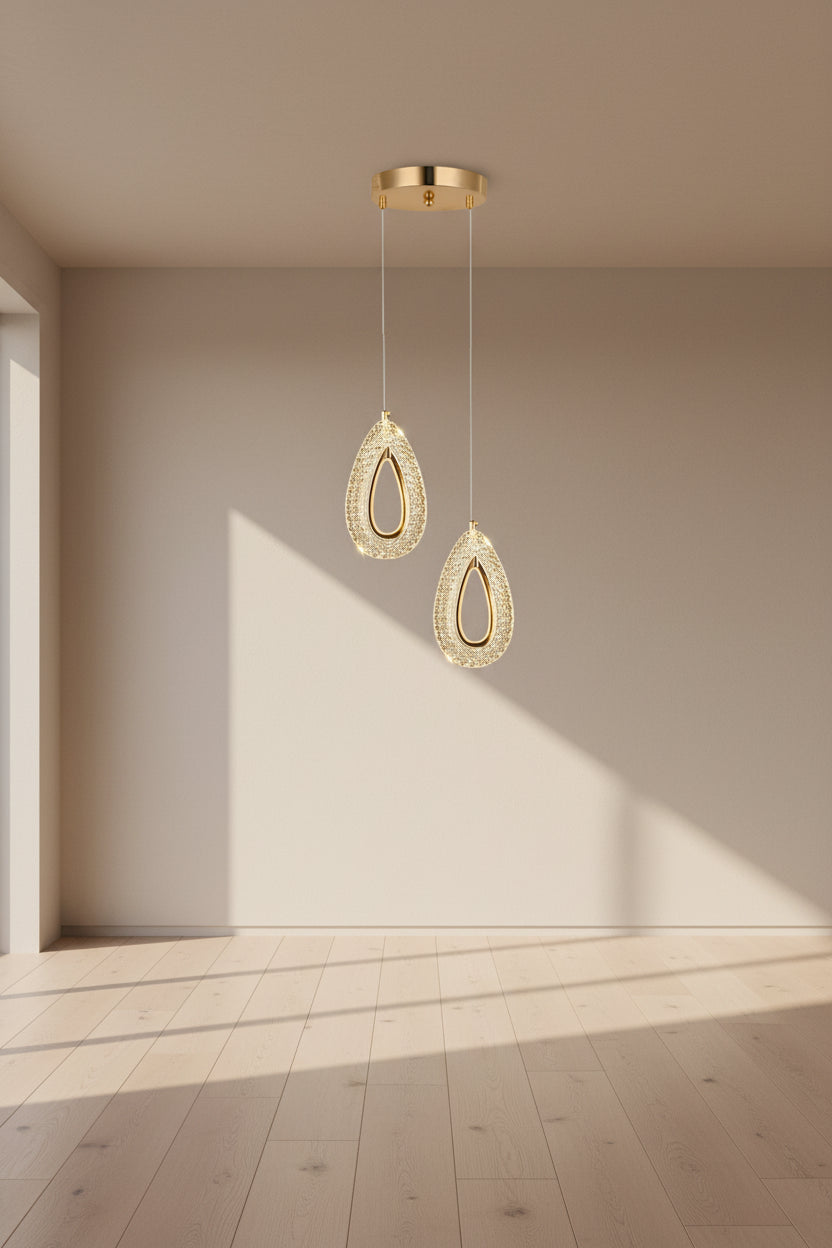 Gold pendant light with measurements on a dark background