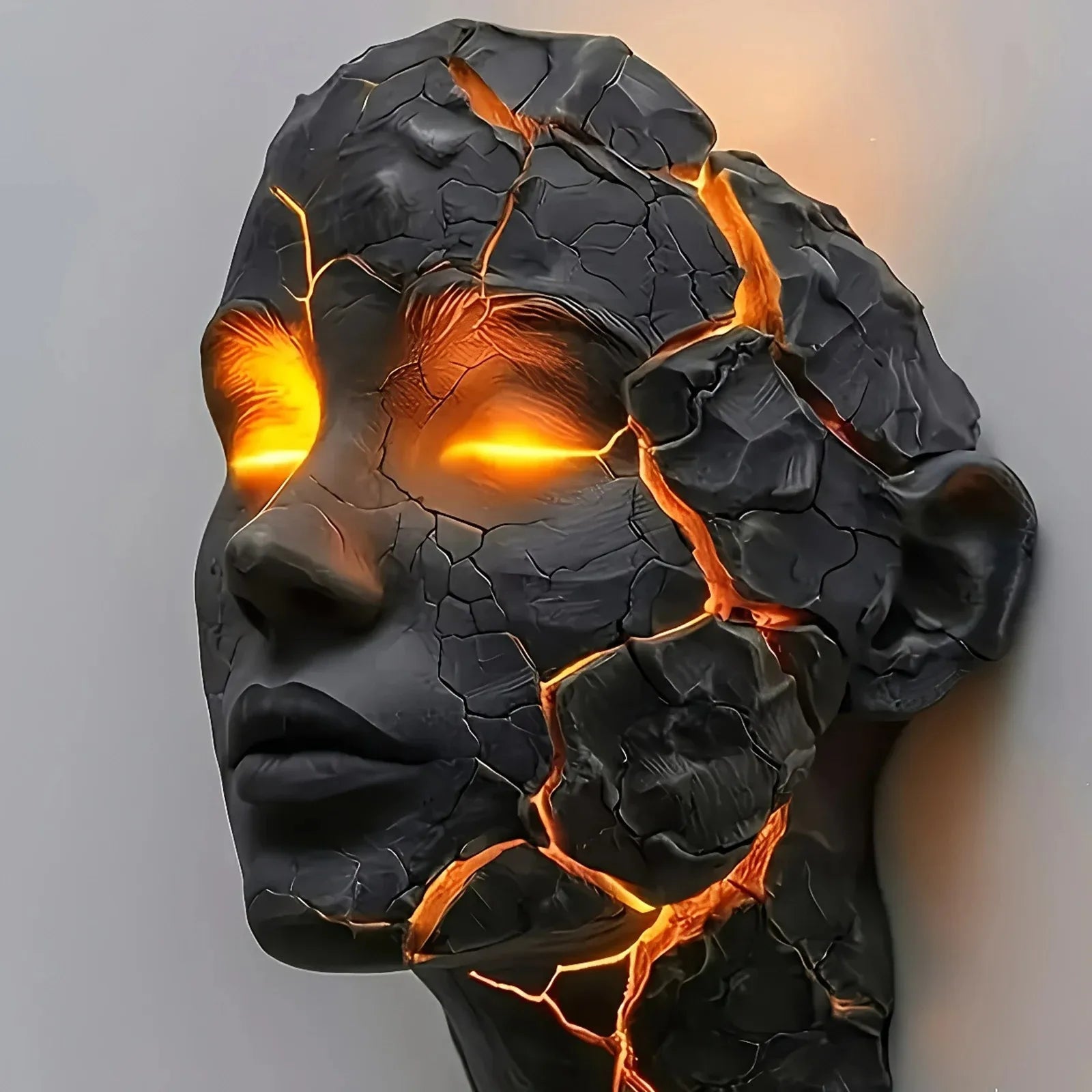 Decorative wall piece with cracked black surface and glowing orange interior