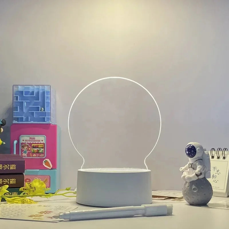 Round LED lamp on a desk with stationery items and a small figurine in the background.