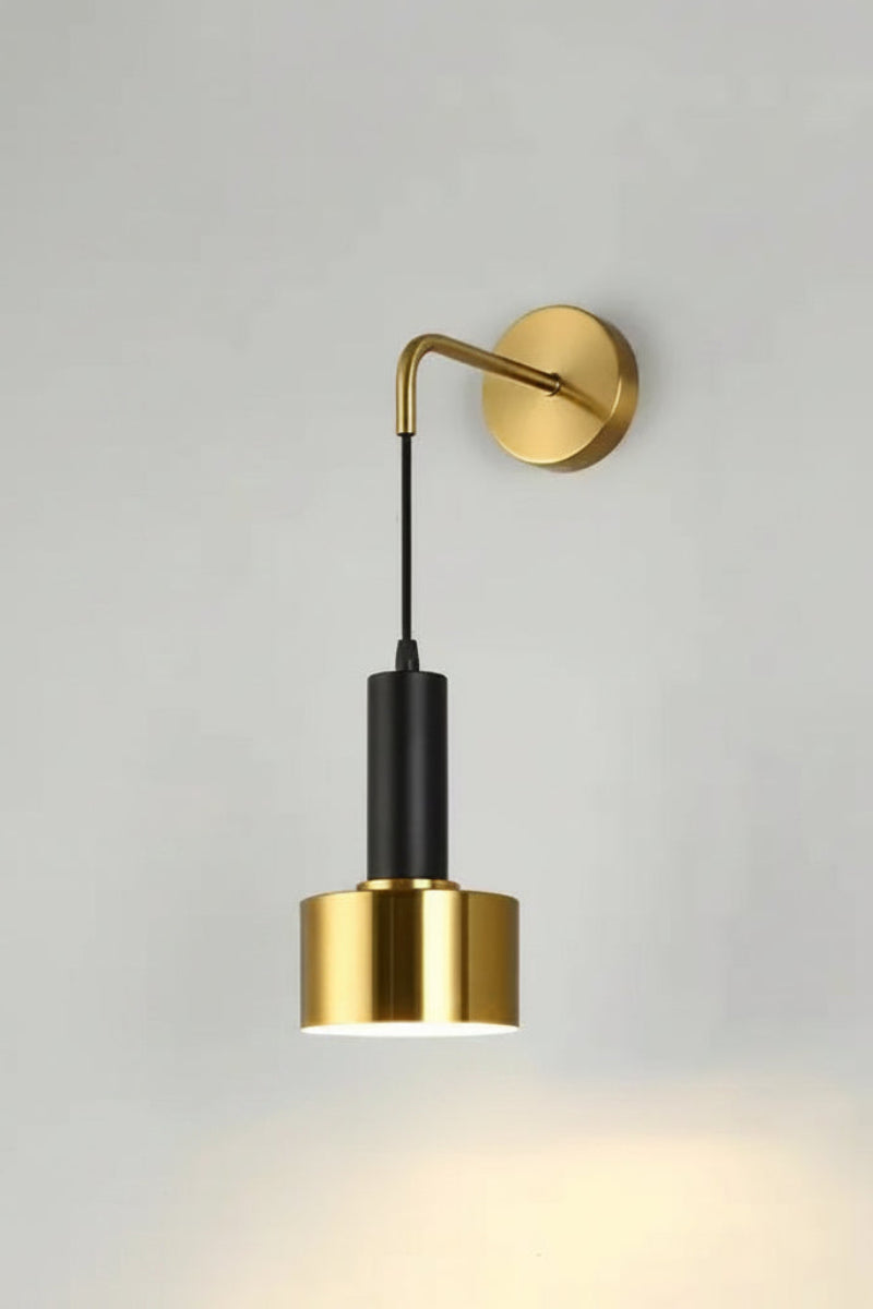 Gold wall lamp with adjustable arm on a light gray background