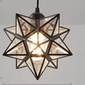 Geometric pendant light with star-shaped design on a gray background
