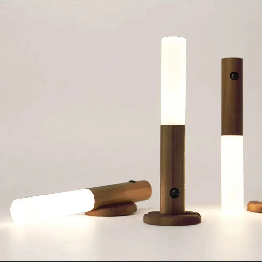 Wooden outdoor lamps with white lights on a neutral background
