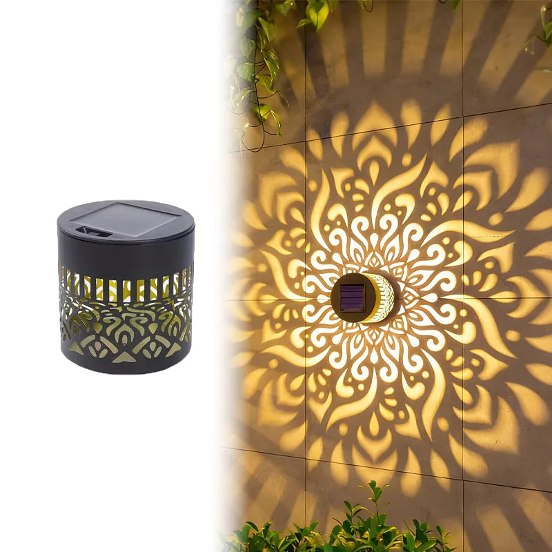 Decorative outdoor light casting a pattern on a wall
