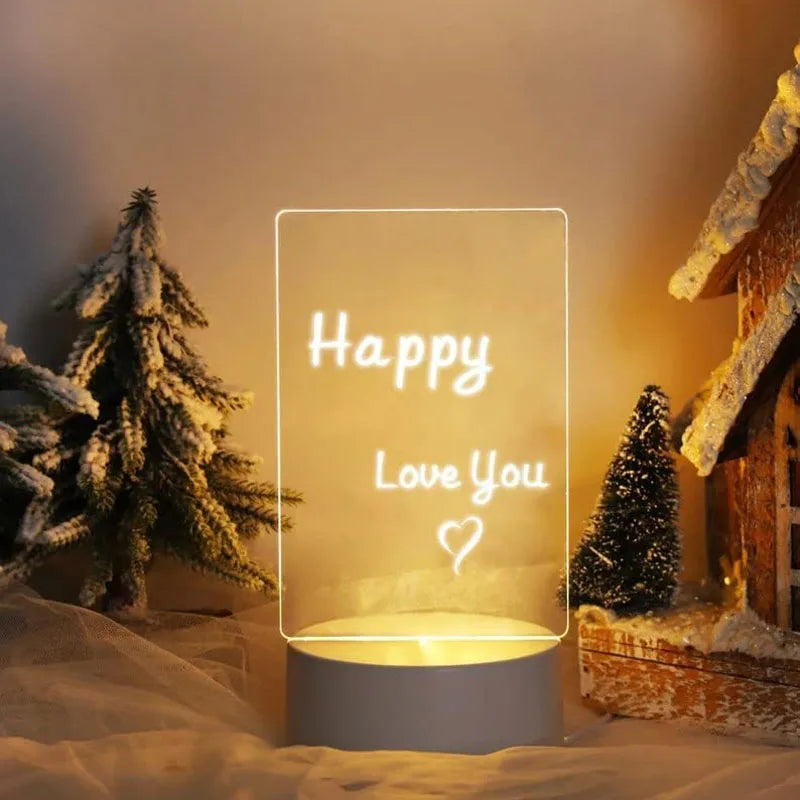 Decorative lamp with 'Happy Love You' text in a snowy landscape with trees and a cabin.