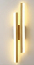 Gold wall-mounted light fixture with LED indicators on a plain background