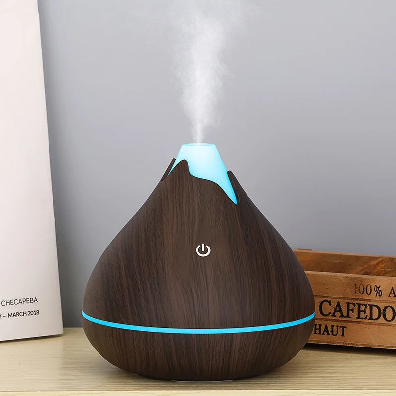 Wooden-patterned diffuser with blue accents on a neutral background