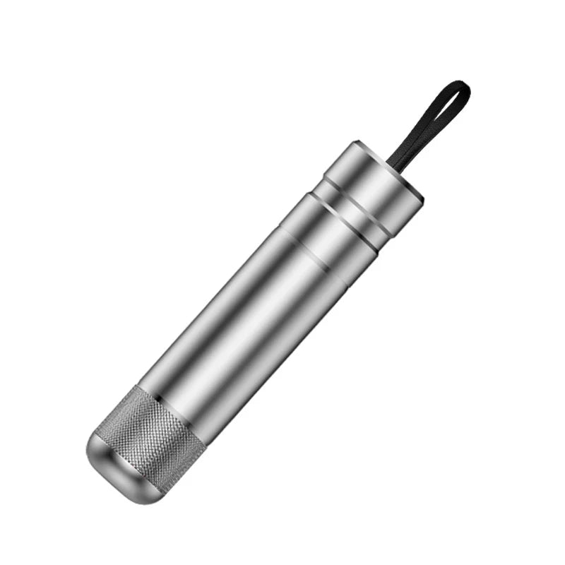 Metallic cylindrical tool with a black handle on a white background