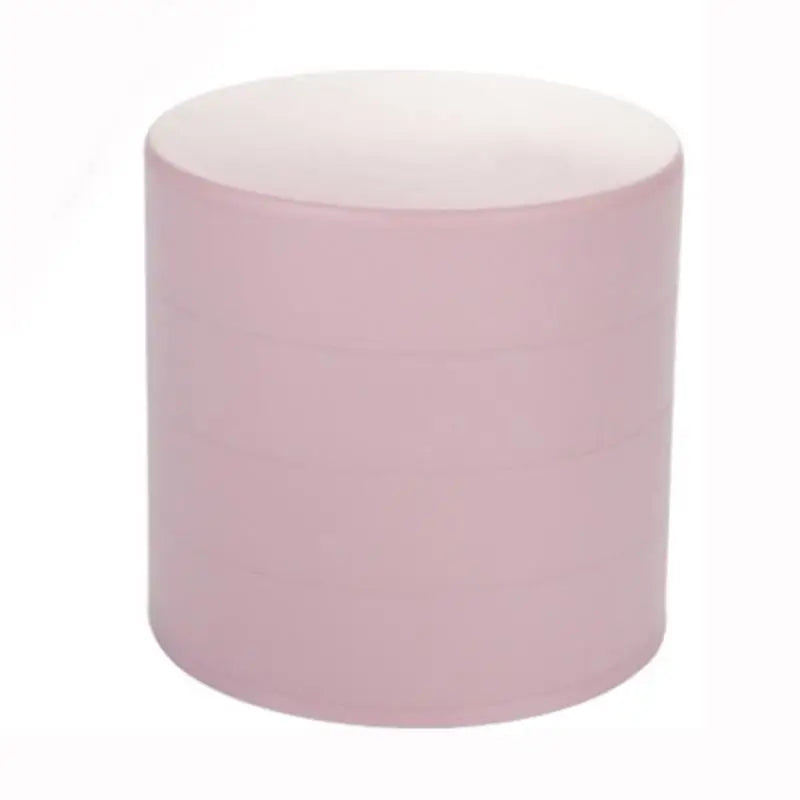 Round pink ottoman on a white background