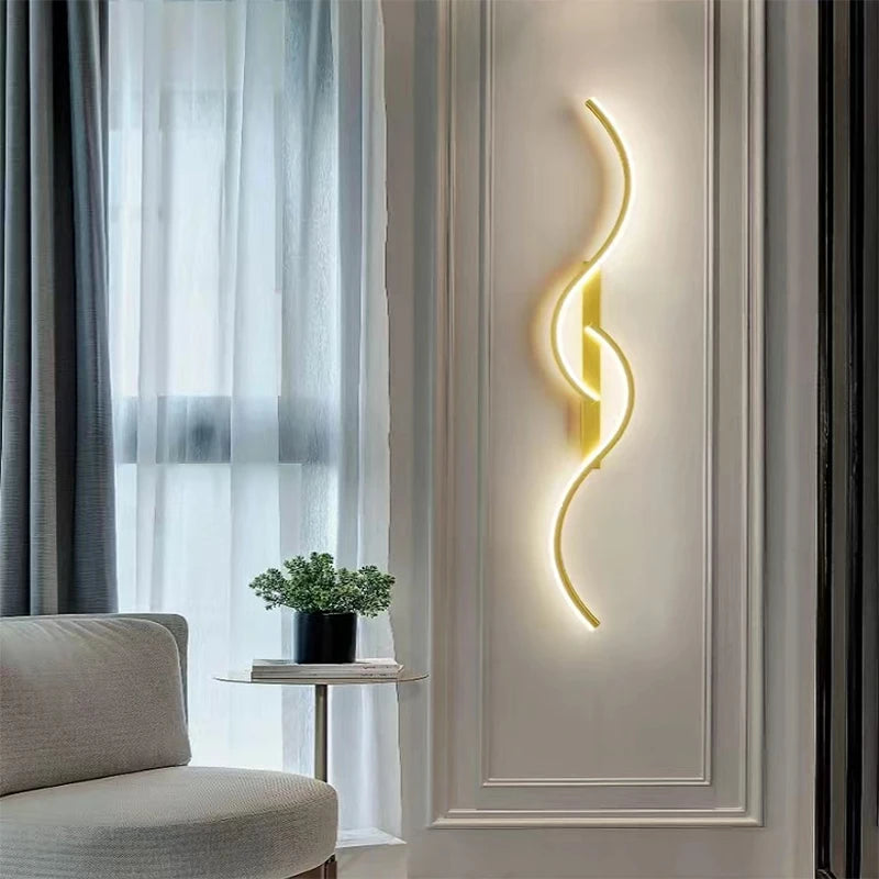 Modern wall light fixture on a decorative wall with a sofa and plant in the background