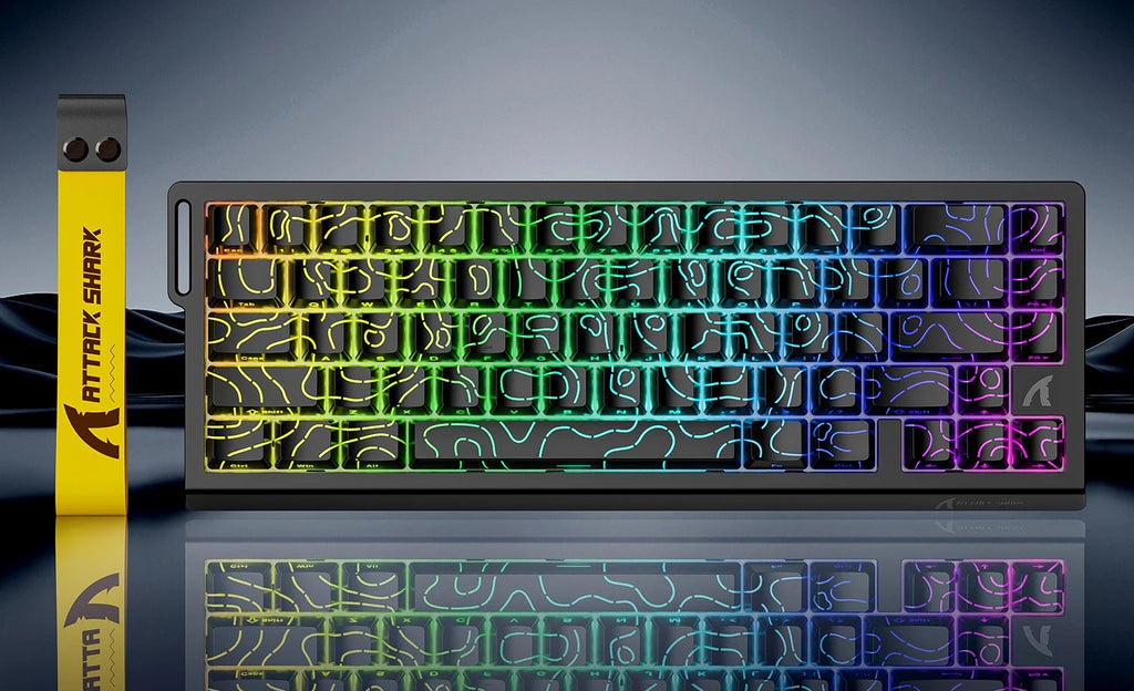 Mechanical keyboard with RGB lighting on a reflective surface, featuring Attack Shark branding.