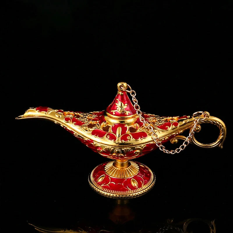 Decorative Aladdin genie lamp with gold and red design on a black background