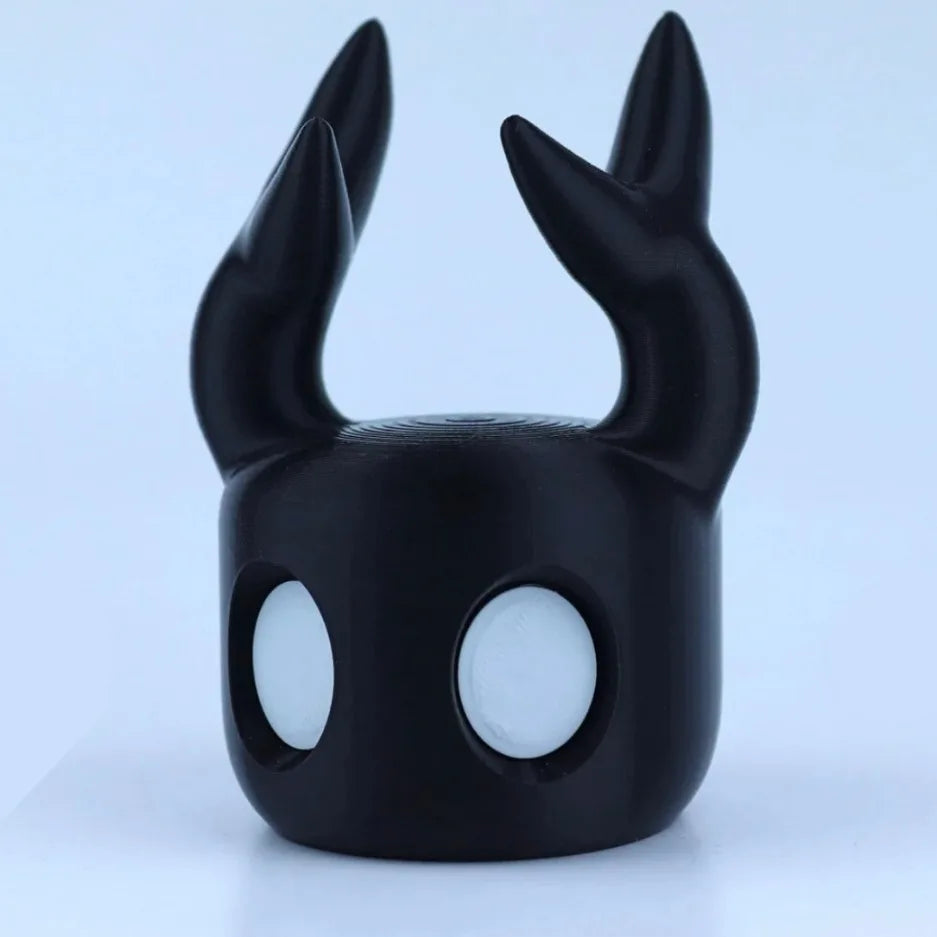 Black mask with large ears on a light blue background
