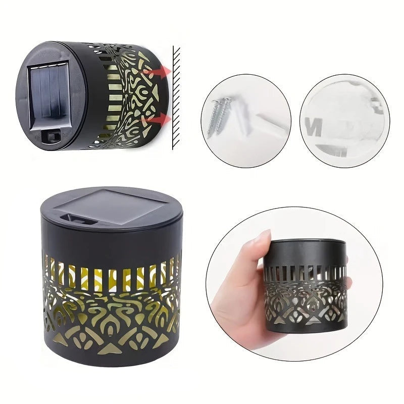 Black solar-powered outdoor light with decorative patterns, held in hand, and shown with dimensions.